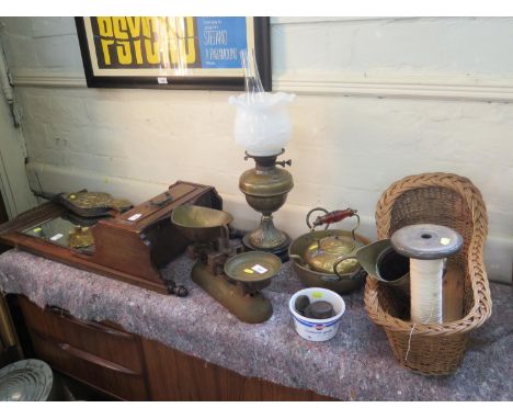 An Edwardian wall mirror with lidded box, brass bellows, oil lamp, scales, other brassware, basket weave crib and a cotton re