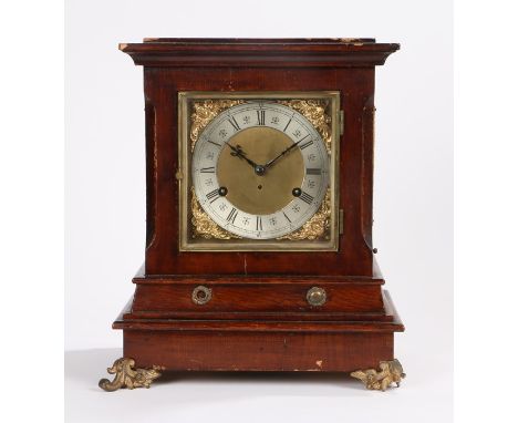 Early 20th Century mantel clock, the step top above a rectangular case raised on rose and scroll gilt metal feet, the dial wi