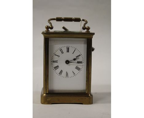 French gilt brass carriage clock, the white enamel dial with Roman numerals