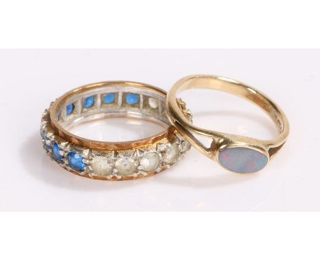 Two 9 carat gold rings, the first set with an opal, the second as a gold and silver eternity ring, total weight 5.3 grams (2)