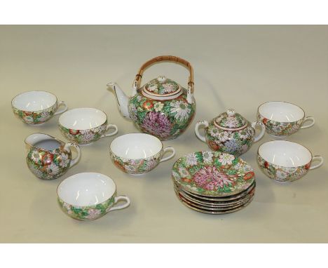 Japanese porcelain tea service, to include a teapot, jug, sugar bowl and six cups and saucers