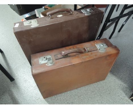 Two vintage leather suitcases