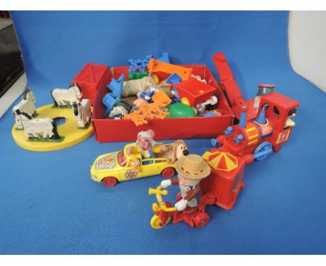 A selection of Magic Roundabout collectables including three Corgi die-cast vehicles and characters, plastic figures and acce