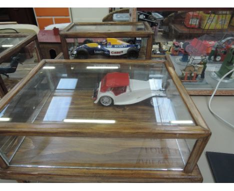 Three scratch built wooden model racing and vintage cars in wooden and glass display cases and another case