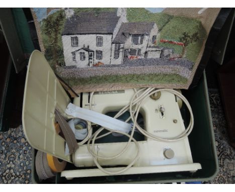 A vintage Bernina minimatic sewing machine in travel case