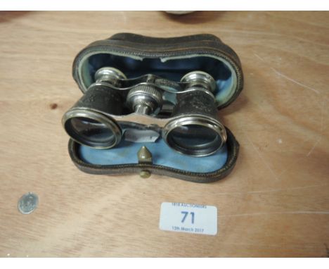 A pair of vintage cased opera glasses