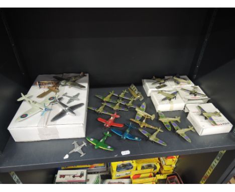 A shelf of plastic and die-cast aeroplanes including Tonka Polistil, Matchbox and Dinky etc