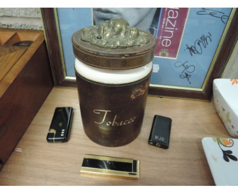 A vintage tobacco jar and three lighters including Calibri