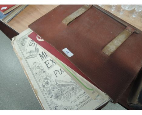 A vintage satchel containing sheet music