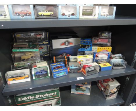 A shelf of modern die-casts including Schuco, Corgi, Busch, Atlas etc, all boxed