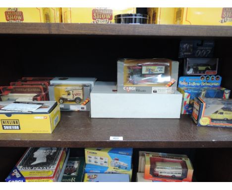 A shelf of Corgi (China), Matchbox (China) die-cast advertising TV and farm related vehicles, all boxed