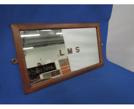 A vintage LMS wall mirror