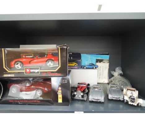 A shelf of mixed die-casts including Burago, Dodge Viper, Franklin Mint Mercedes Benz 300SL x 3 etc  some boxed