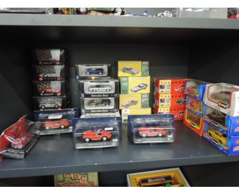 A shelf of modern die-casts including Vanguards, Brumn, New Ray etc all boxed