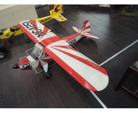 A 1970's radio controlled model aeroplane numbered HC4251 having four stroke engine, and two similar model aeroplane  having 