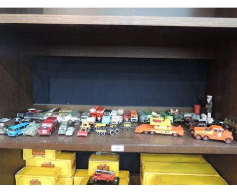 A shelf of mixed die-cast including Matchbox, Dinky, LFE etc