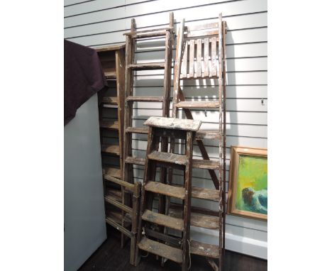 A selection of vintage wood step ladders and clothes maid