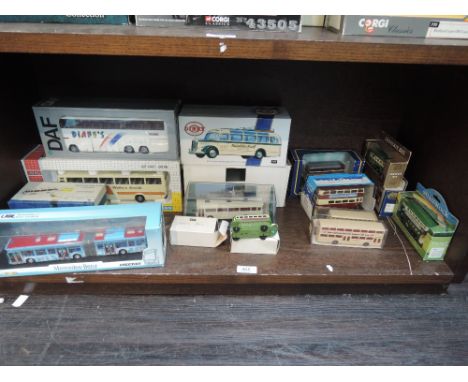 A shelf of mixed die-cast buses including Joel, Dinky (China) etc and two model kits, all boxed