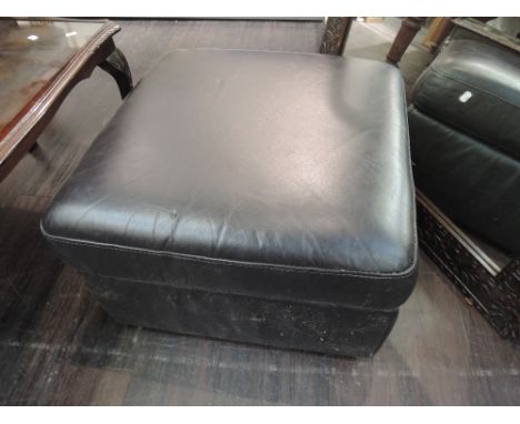 A modern leatherette pouffe