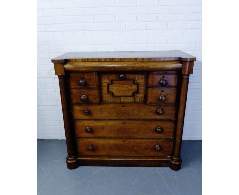 A 19th century mahogany scotch chest having a shaped top over secret long drawer above four short and three graduating long d