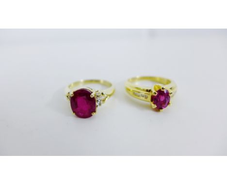 An 18 carat gold ruby and diamond dress ring together with a 9 carat gold ruby and diamond dress ring (2) 