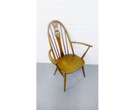 An Ercol ladder back chair with swan roundel 