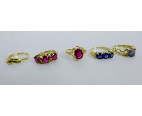 An 18 carat gold ruby set ring together with four 9 carat gold dress rings (5) 