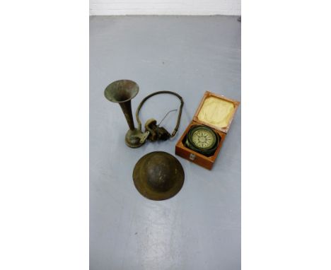 A mixed lot to include a boxed compass, a French motor horn and a WWII helmet (3) 