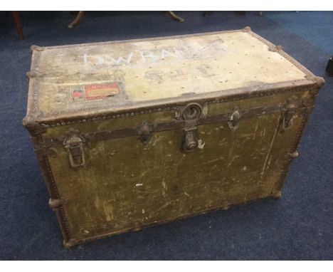 A large American cabin trunk by Mendel, with iron mounts and raised on rollers, bearing Cunard White Star Line labels. (40in 