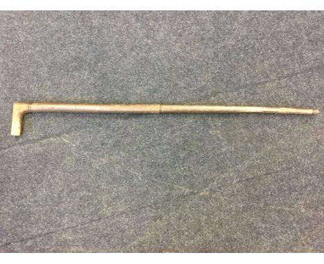 A nineteenth century shooting stick, with tapering steel barrel and oak handle - deactivated. (41.5in)