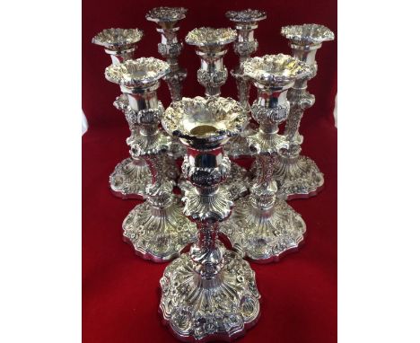 A set of eight William IV silver candlesticks by Henry Wilkinson, Sheffield 1834, the columns cast with scrolling leaves, flo