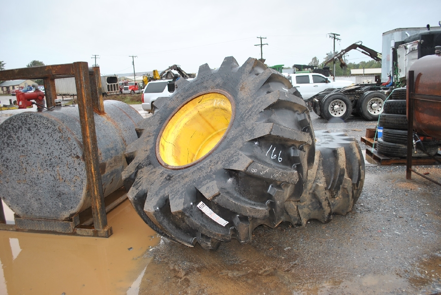 (1) NEW 30.5 X 32 SKIDDER TIRE ON JOHN DEERE WHEEL (1) USED 30.5 X 32