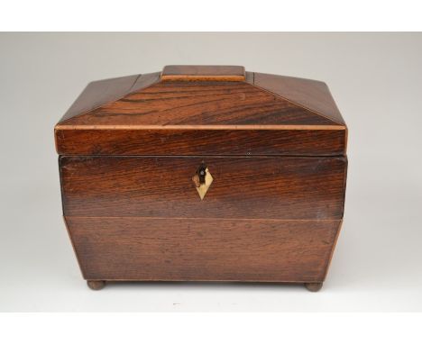 An early 19th Century rosewood tea caddy, with two sections to interior