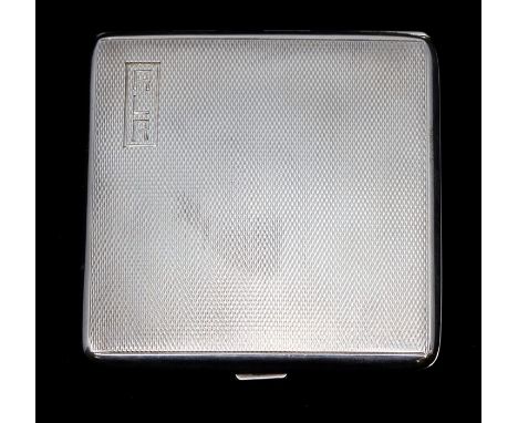 A silver compact by Harman Brothers, Birmingham 1937, square form with engine turned decoration, size approx. 7.5cm, push but