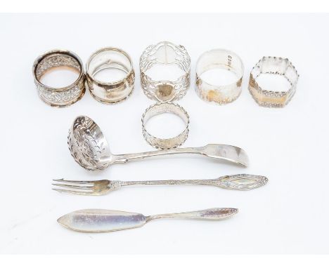 A collection of assorted silverware comprising six napkin rings, various dates and assay offices, a William IV silver sifter 