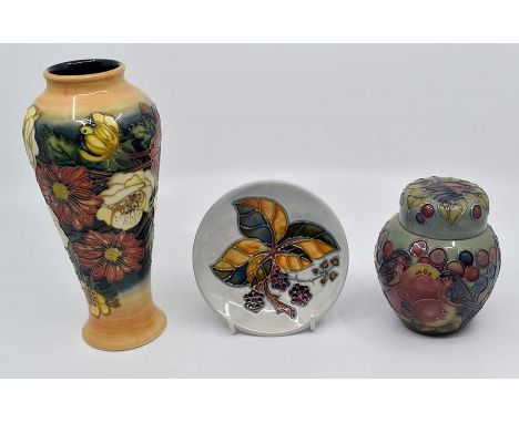 Three pieces of late 20th Century Moorcroft to include a small ginger jar, posy vase, and a boxed pin dishCR; no chips or cra