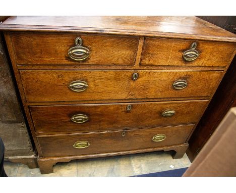 A 19th Century oak chest of drawers, the moulded top over two short and three long graduated drawers with later brass swing o