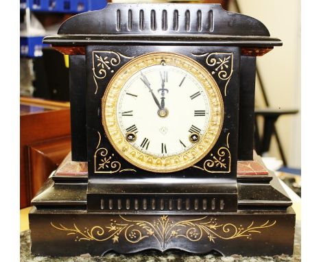 A late 19th Century black slate and marble mantel clock, eight day movement, cream enamelled dial, Roman numerals