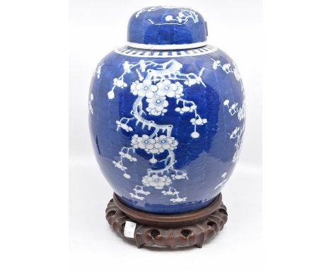 A late 19th Century blue and white ginger jar, on stand, no marks to base, with a blue a white Chinese fluted vase, signed to