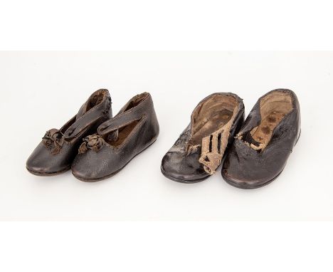 &nbsp;Two pairs of hard stuff leather baby shoes, the damaged pair have a wide strap (button missing and a small tear on fron