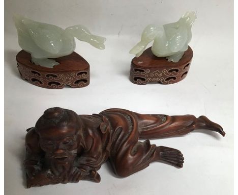 Root carving of a fisherman and two Jade Ducks each on wooden plinth. Carving 14cm long. Ducks approximately 8cm long.
