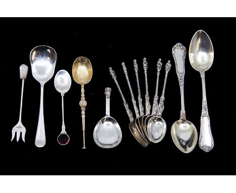 A George VI silver caddy spoon with cast Devil terminal by J.H.B, Birmingham, 1938 together with a set of six Apostle style t