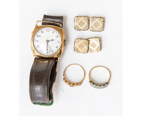 A gold cased wristwatch on leather strap, hairlines to dial, total gross weight approx. 27gms, along with an emerald and diam