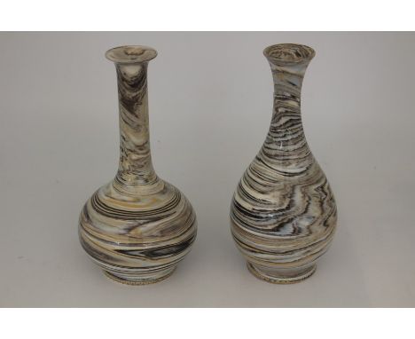 Two Wedgwood swirl pattern ceramic vases, made with colouring ceramic in a marble effect each measuring approx 19.5 cms in he