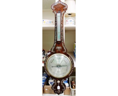 An early 20th Century Barnascone of Sheffield rosewood banjo barometer and thermometer, decorated throughout with mother-of-p