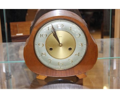 A Smiths oak cased eight day mantel clock, circa 1960, having a presentation plaque dated 1961