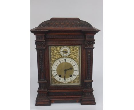 An Edwardian oak bracket clock, eight day movement, the dial inscribed 'F Butterfield, Liverpool', bearing presented to Col. 