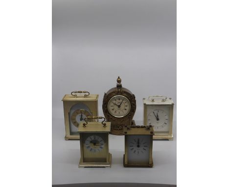 A collection of five assorted mantel clocks, quartz movement, various sizes