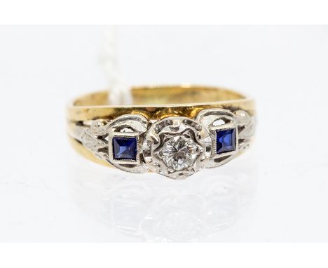 A yellow metal diamond and blue stone ladies dress ring, the blue stones probably sapphires, the single diamond stone of appr