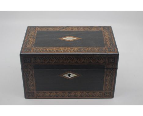 An early to mid Victorian ebony and parquetry veneered tea caddy, with two internal lidded sections, mother of pearl escutche
